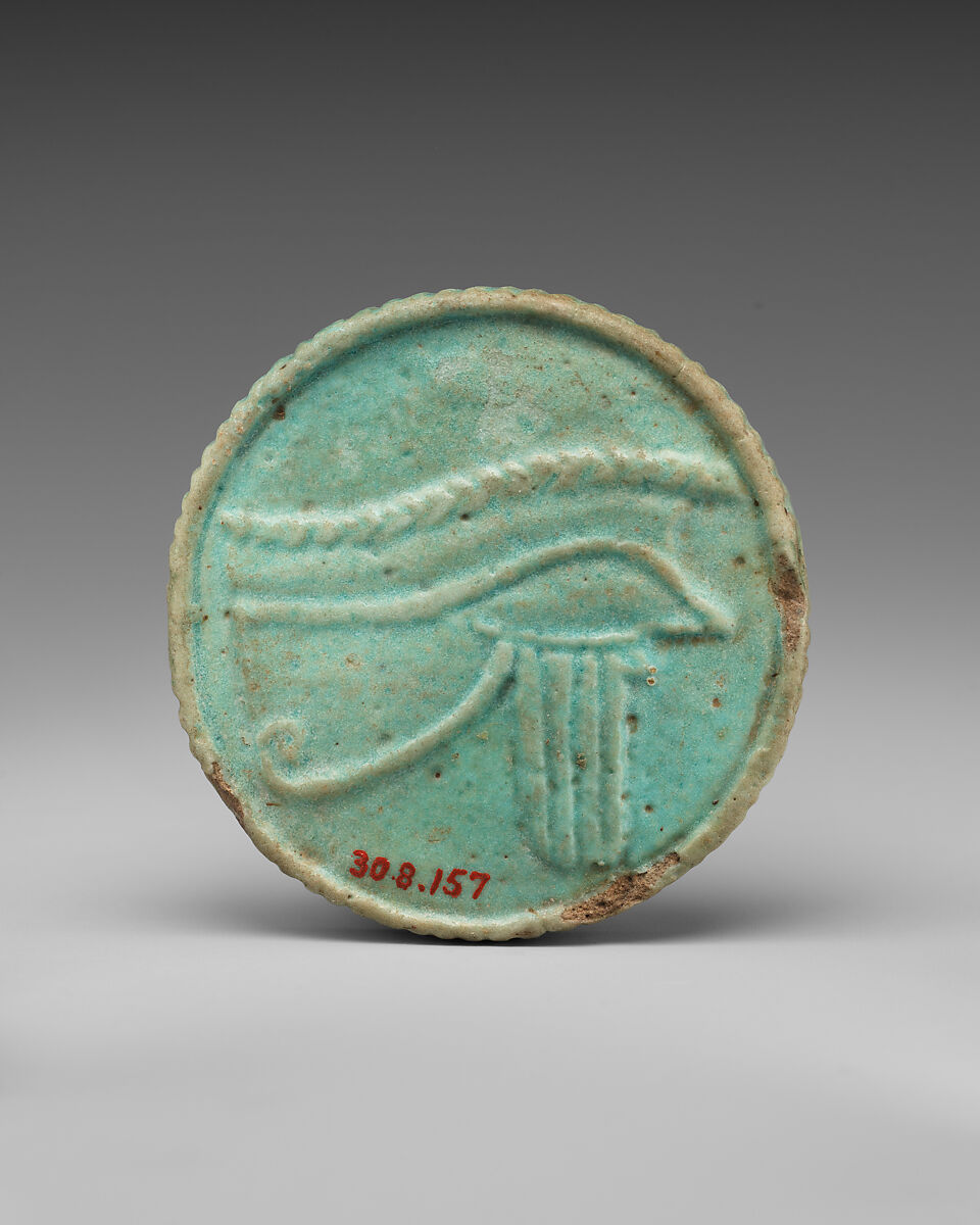 Head of Bes and Sacred eye Amulet, Light green faience