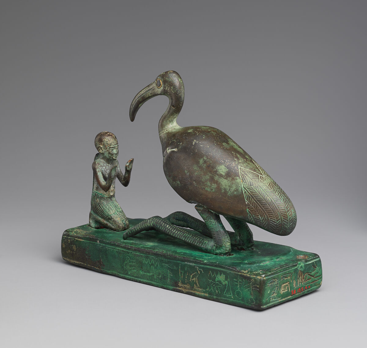 Group statue of Thoth-ibis and devotee on a base inscribed for Padihorsiese, Cupreous metal