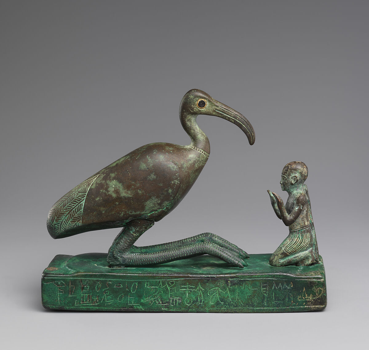Group statue of Thoth-ibis and devotee on a base inscribed for Padihorsiese, Cupreous metal