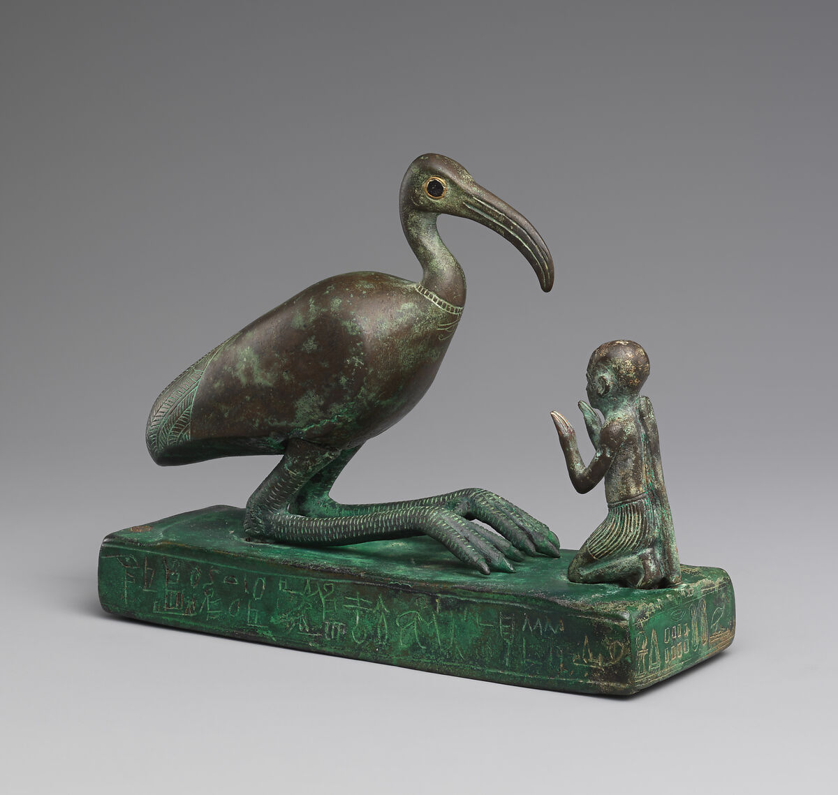 Group statue of Thoth-ibis and devotee on a base inscribed for Padihorsiese, Cupreous metal