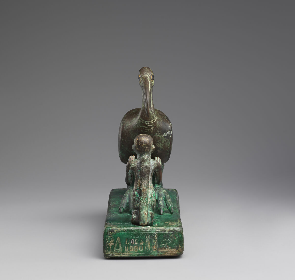 Group statue of Thoth-ibis and devotee on a base inscribed for Padihorsiese, Cupreous metal