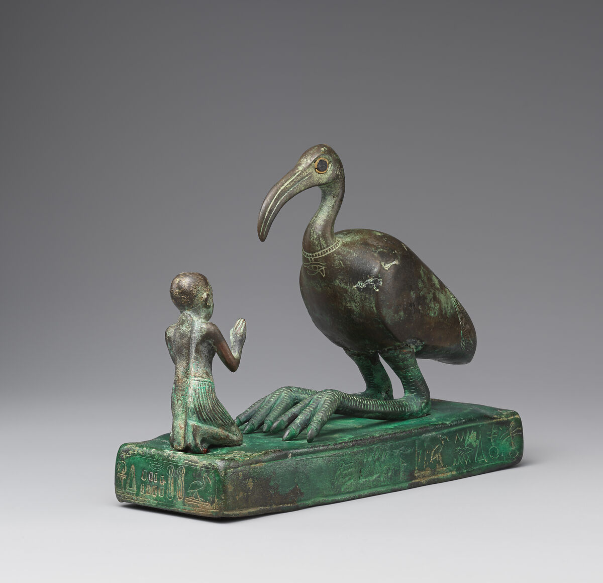 Group statue of Thoth-ibis and devotee on a base inscribed for Padihorsiese, Cupreous metal