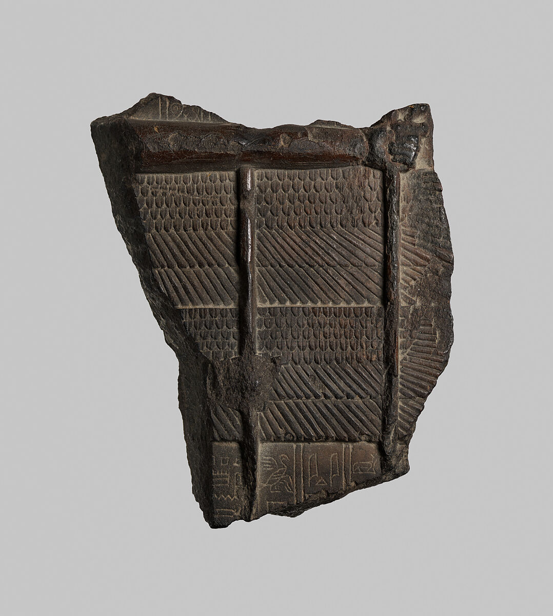 Stela of a polymorphic god, Black steatite