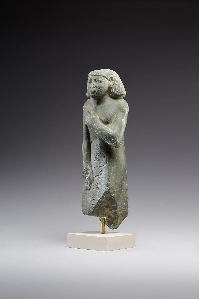 Middle Kingdom statuette, reinscribed for Harsiese High Priest of Memphis in the Third Intermediate Period, Greywacke