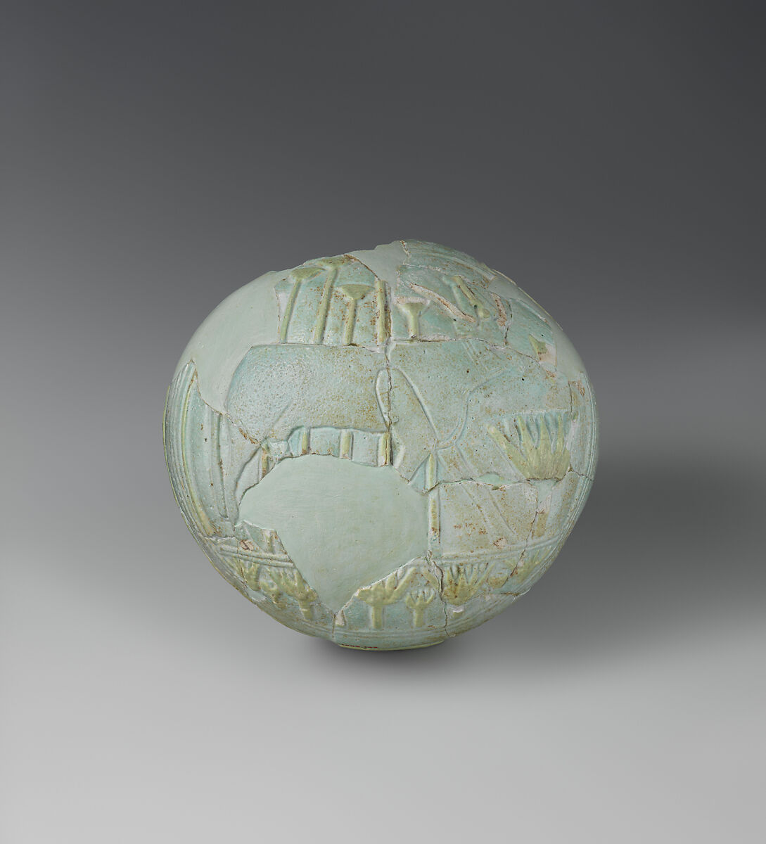 Lentoid Bottle ("New Year's Bottle"): Hathor sistrum on one side, cow in marshes on the opposite, Faience