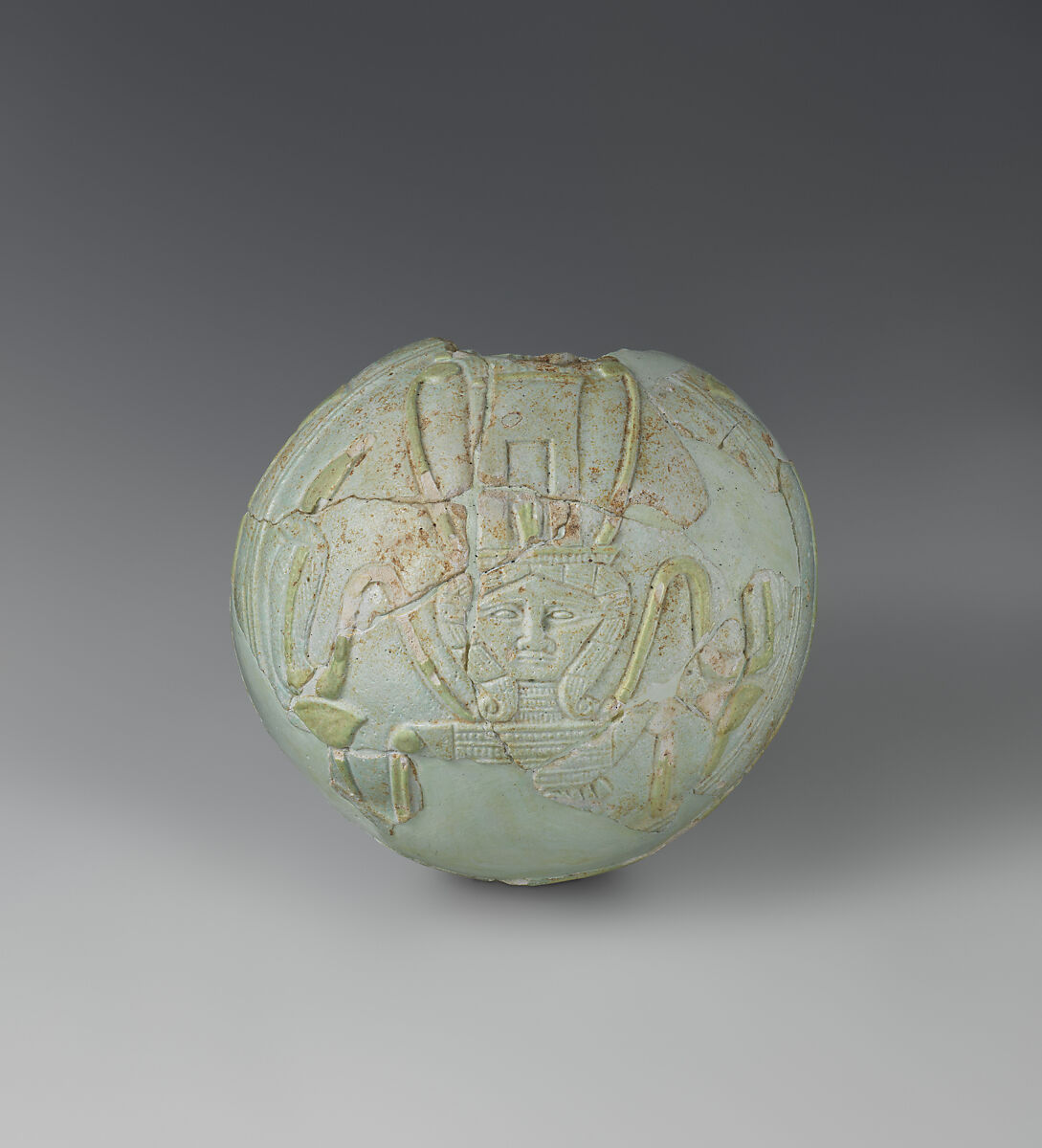 Lentoid Bottle ("New Year's Bottle"): Hathor sistrum on one side, cow in marshes on the opposite, Faience 