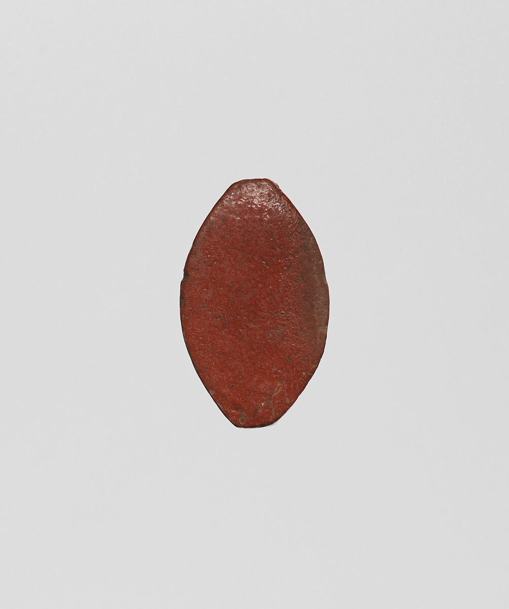 Cowroid with a standing female figure, Faience