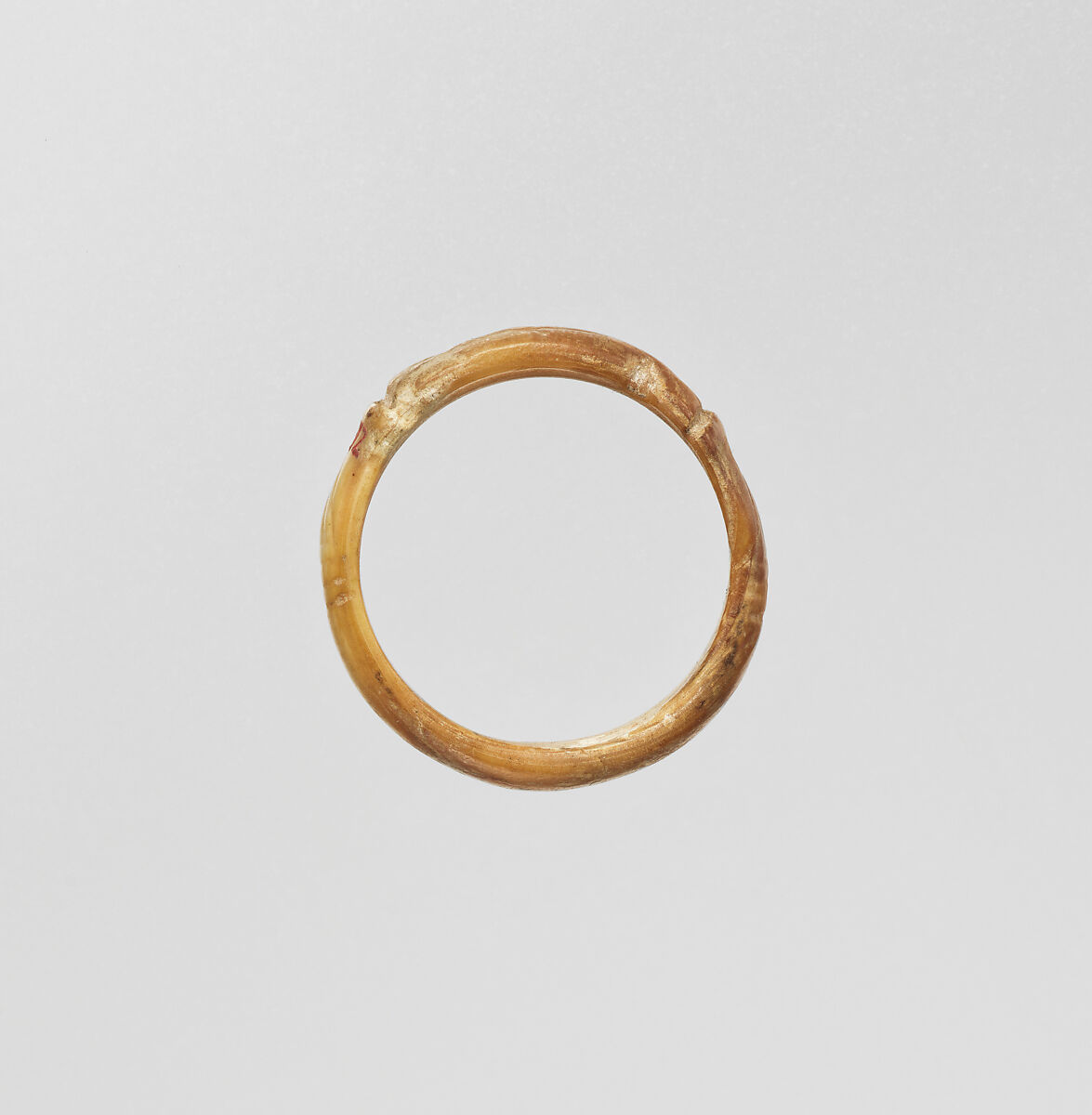 Ring with a bezel in the form of a uraeus, Bone