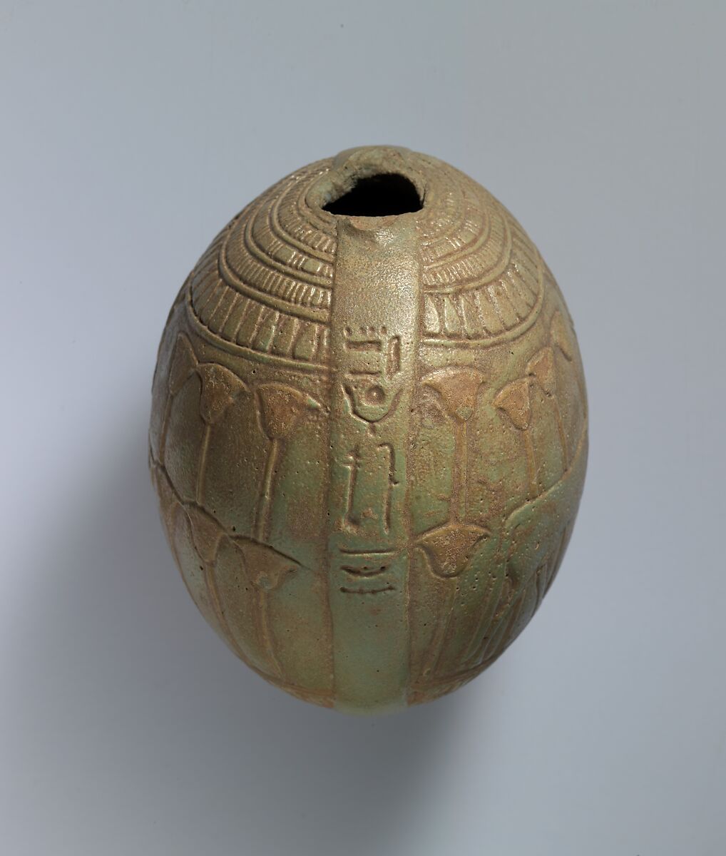 Relief-decorated Lentoid Bottle ("New Year's Bottle"); Horus falcon in marshes on one side; cow goddess in marshes on the other, Faience