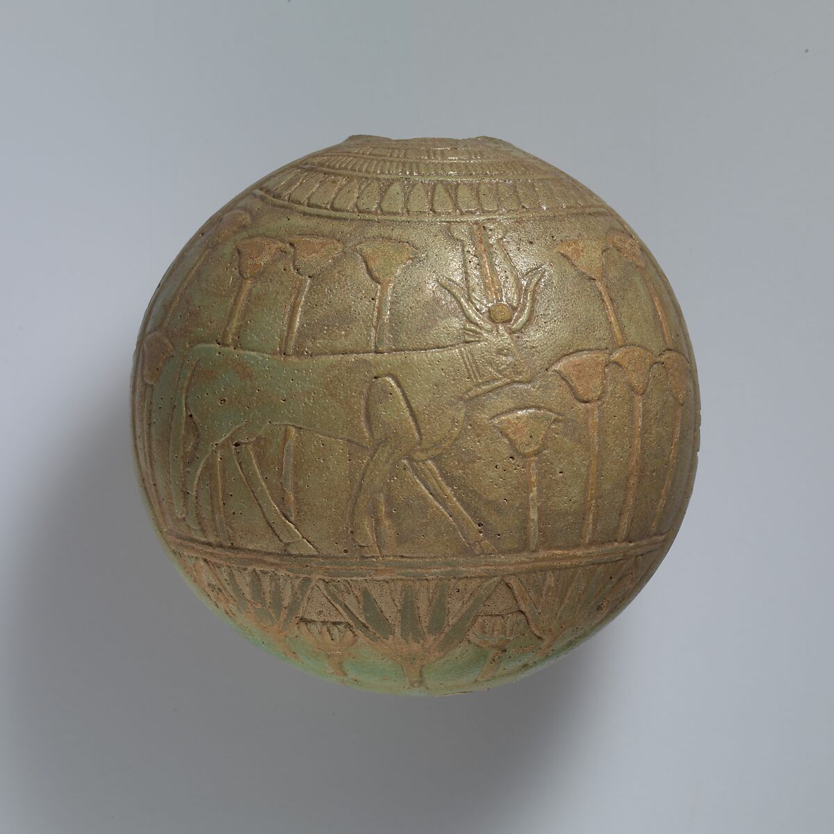 Relief-decorated Lentoid Bottle ("New Year's Bottle"); Horus falcon in marshes on one side; cow goddess in marshes on the other, Faience 