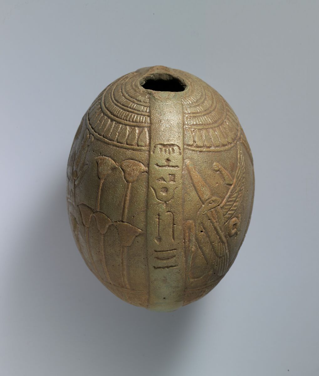 Relief-decorated Lentoid Bottle ("New Year's Bottle"); Horus falcon in marshes on one side; cow goddess in marshes on the other, Faience