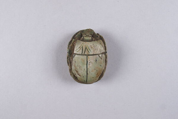 Scarab with Bes and prisoners, Glazed steatite