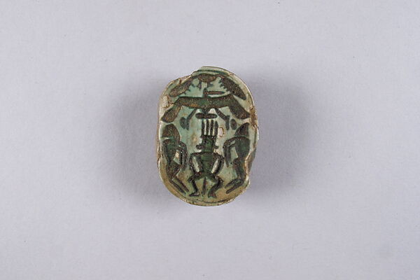 Scarab with Bes and prisoners, Glazed steatite 