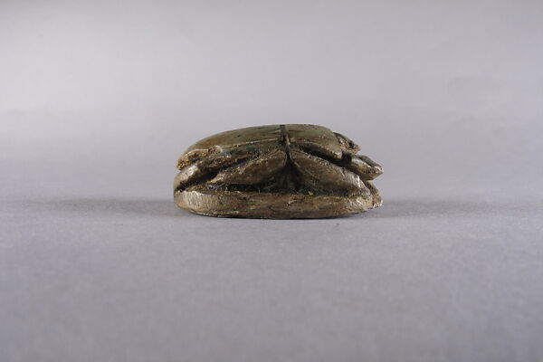 Scarab with Bes and prisoners, Glazed steatite