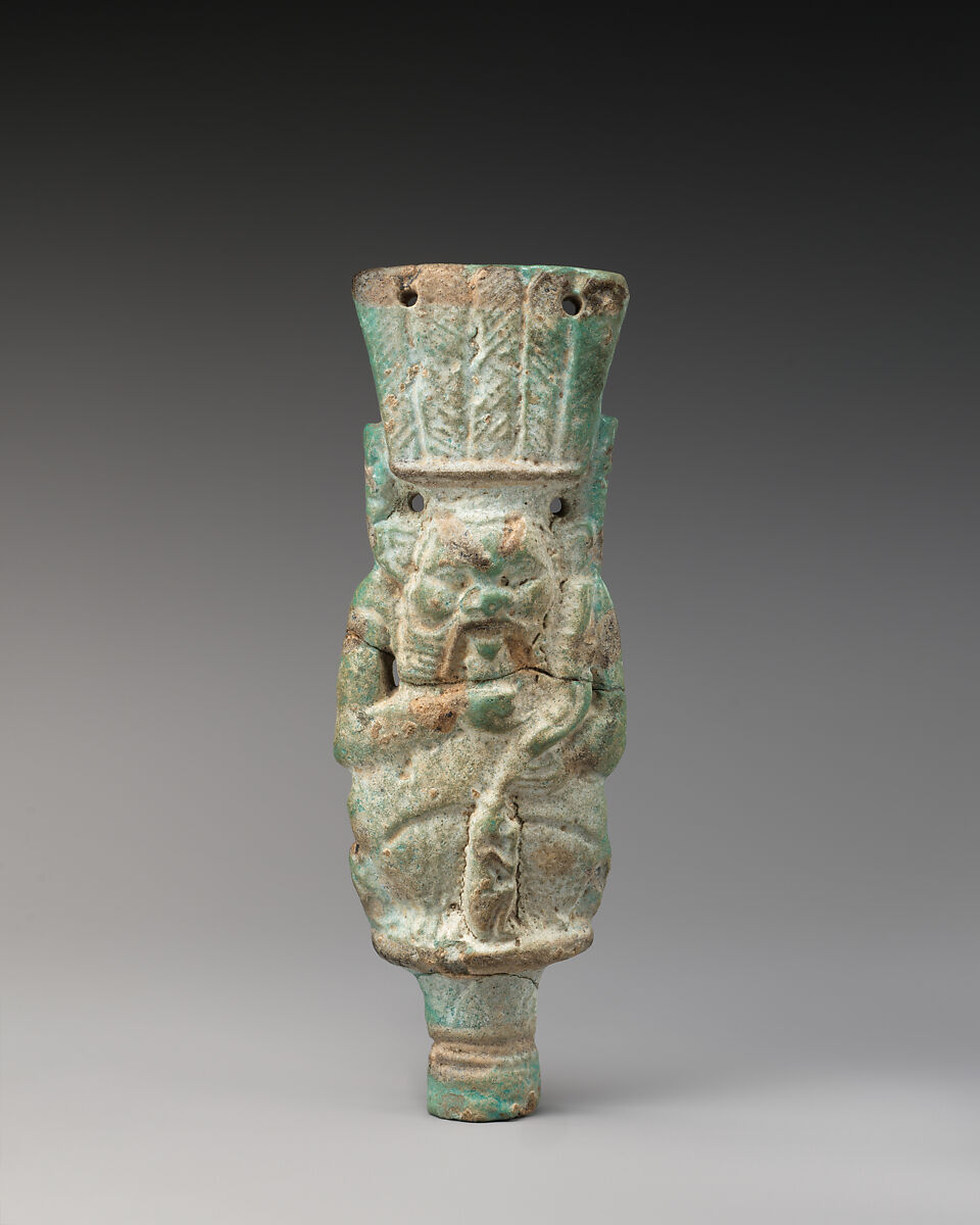 Bes with child on finial, Faience