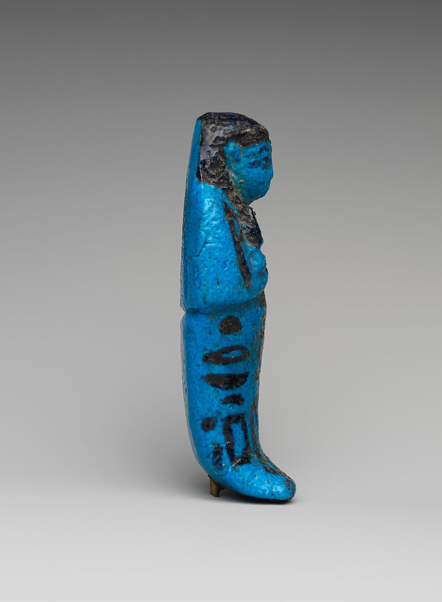 Shabti of the Adoratrice of Hathor Henettawy, wife of Painedjem I, Faience