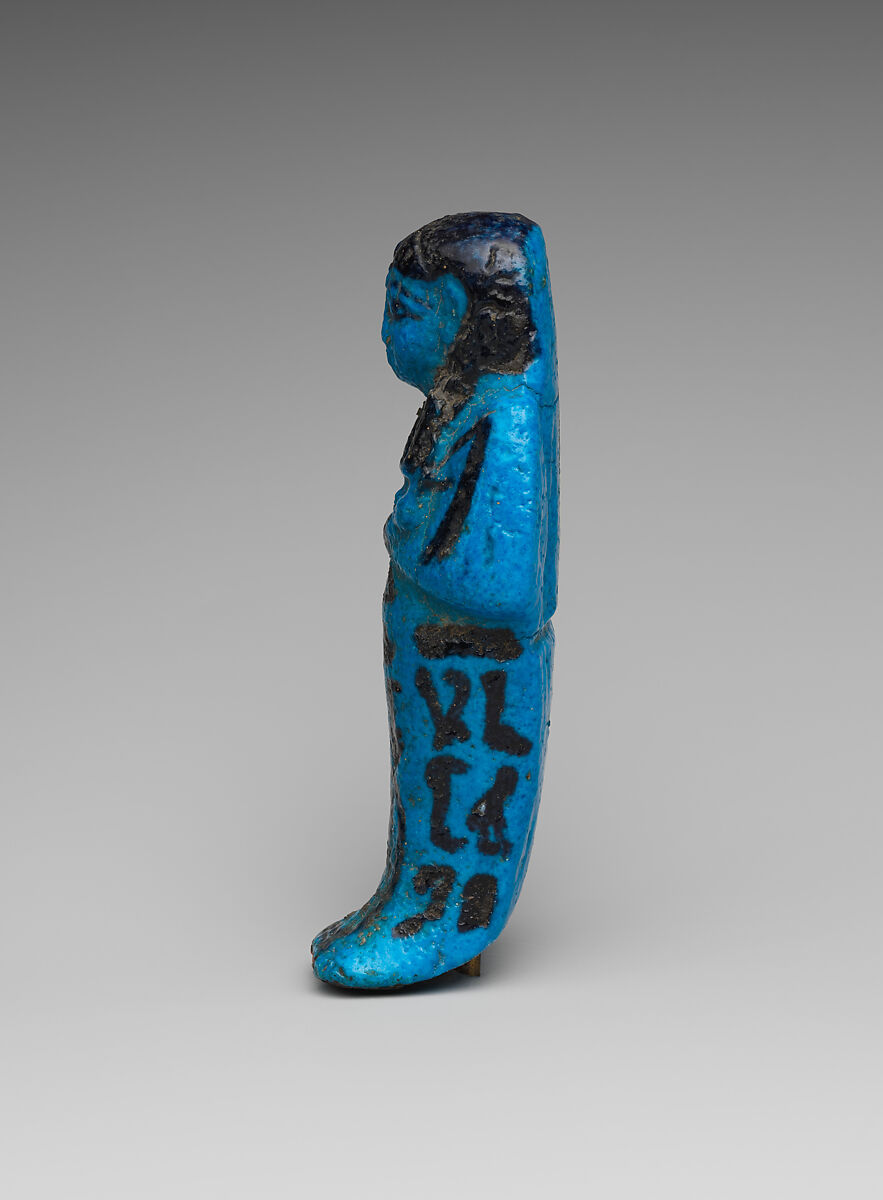 Shabti of the Adoratrice of Hathor Henettawy, wife of Painedjem I, Faience
