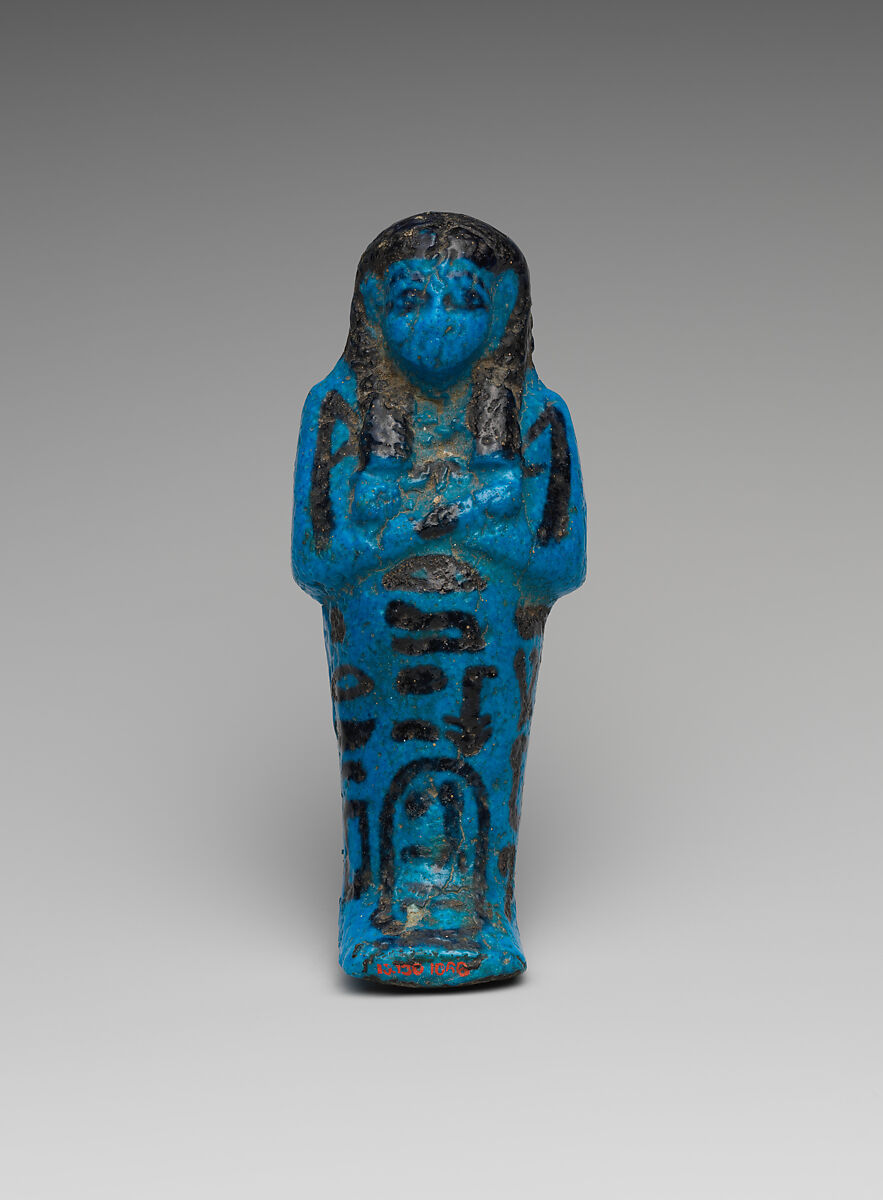 Shabti of the Adoratrice of Hathor Henettawy, wife of Painedjem I, Faience 