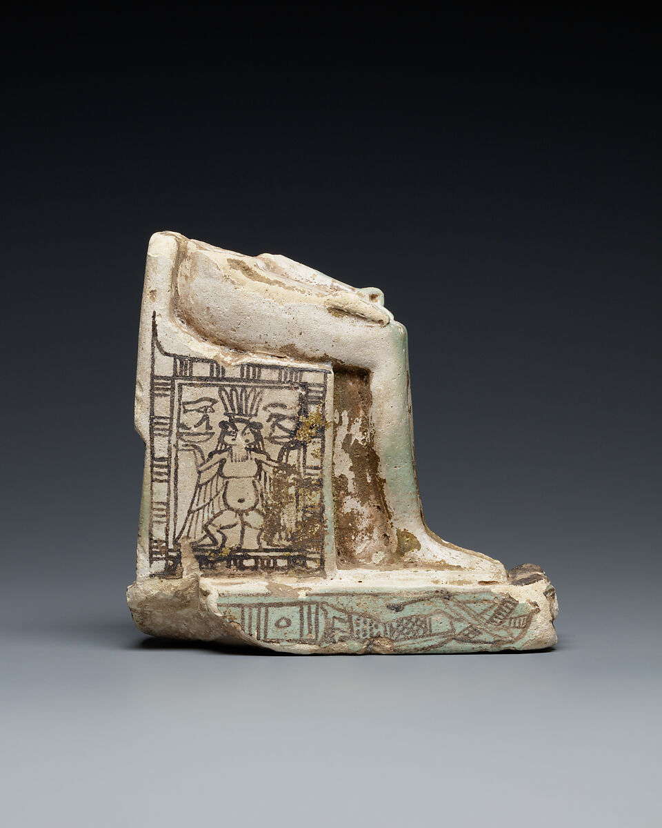 Lower half of a goddess on a throne with Bes figures, its base formed by prostrate captives, Faience