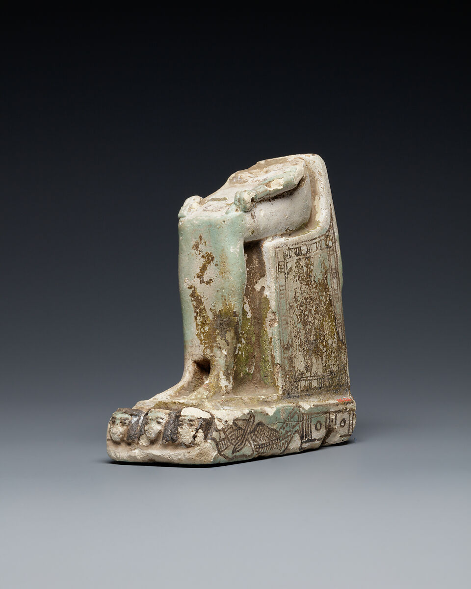 Lower half of a goddess on a throne with Bes figures, its base formed by prostrate captives, Faience