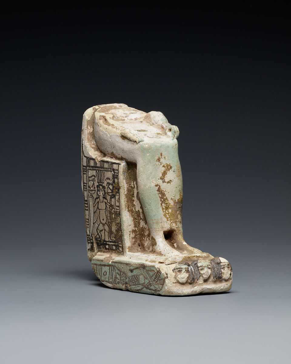 Lower half of a goddess on a throne with Bes figures, its base formed by prostrate captives, Faience 