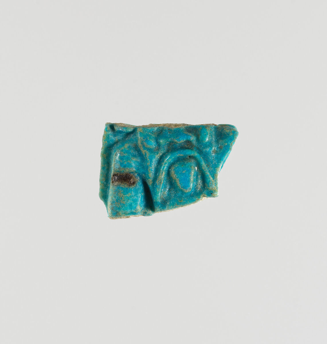 Wall fragment of a chalice with Bes face, Faience 
