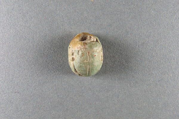 Scarab of Usermaatre, White faience, traces of green glaze