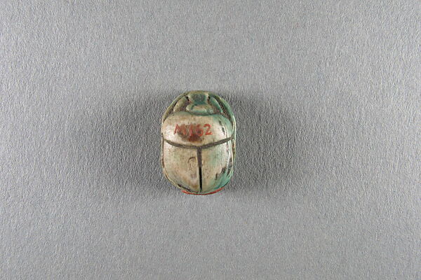 Scarab inscribed with the name Shepenwepet, Steatite, traces of green glaze