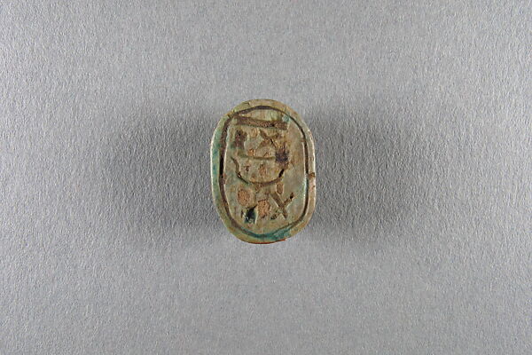 Scarab inscribed with the name Shepenwepet, Steatite, traces of green glaze 