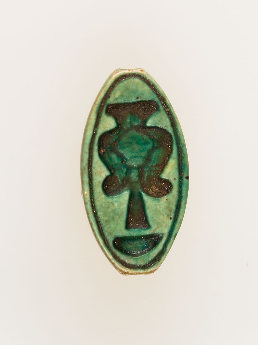 Cowroid with a Hathor emblem, Faience 
