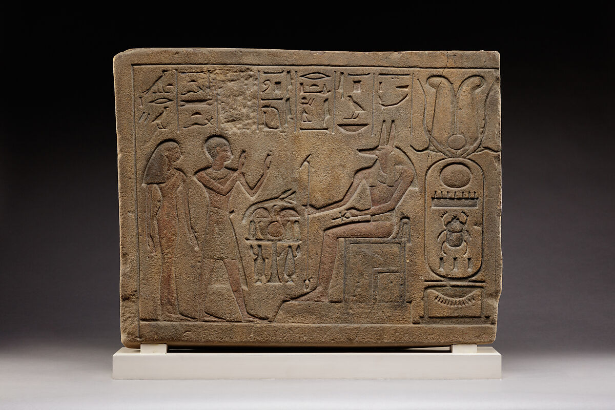 Stela of Siamun and Taruy worshipping Anubis, Sandstone, paint 