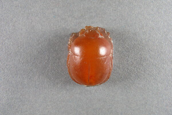 Scarab Inscribed with Horus Supporting the Sun Disk, Carnelian, copper