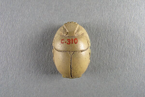 Scarab, Faience, yellow with traces of green glaze