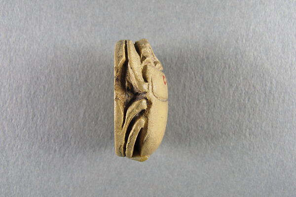 Scarab, Faience, yellow with traces of green glaze