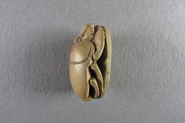 Scarab, Faience, yellow with traces of green glaze