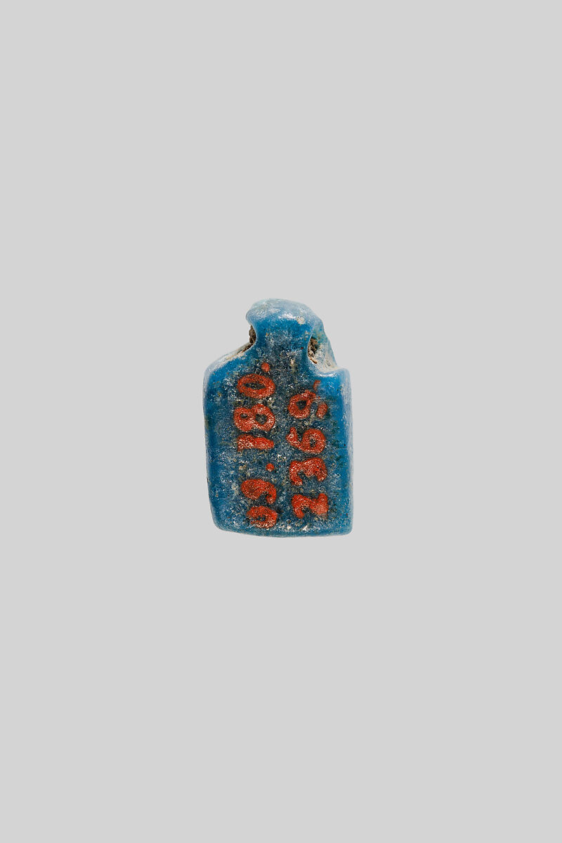 Amulet of a standing deity, Faience