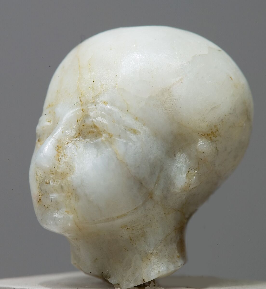 Head with cap and beardstraps, perhaps Ptah, Quartz
