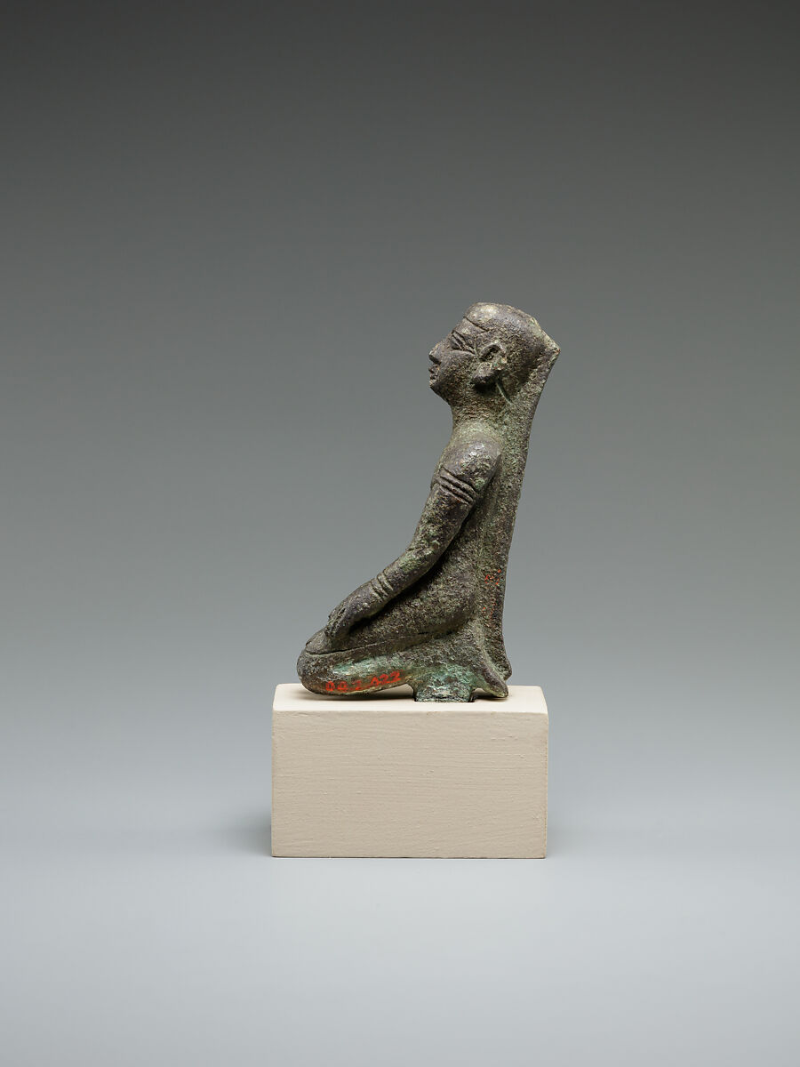 Kneeling priest, Bronze or cupreous alloy