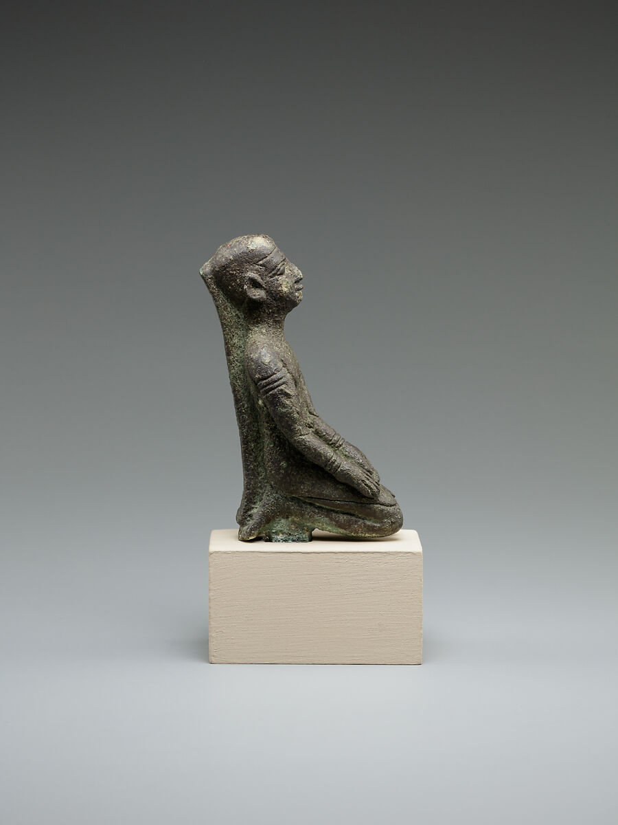 Kneeling priest, Bronze or cupreous alloy