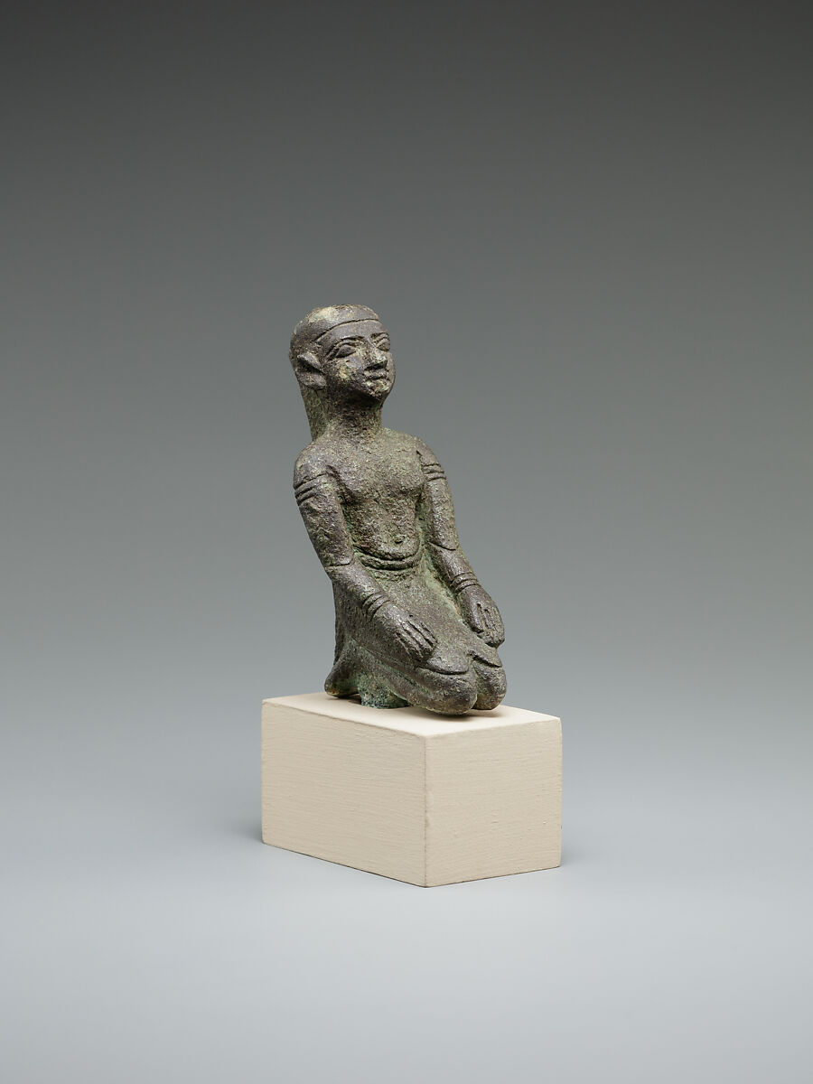 Kneeling priest, Bronze or cupreous alloy