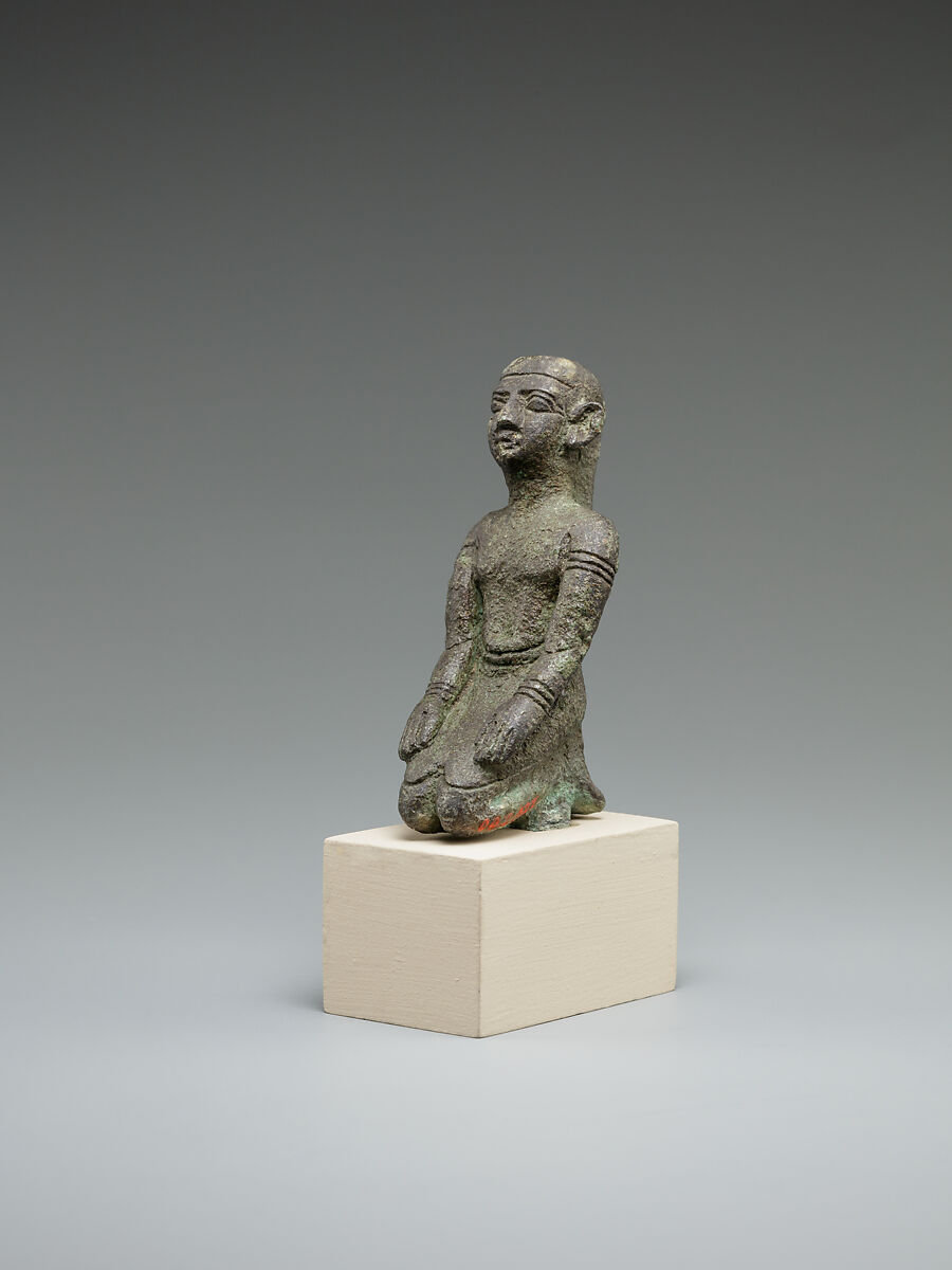 Kneeling priest, Bronze or cupreous alloy