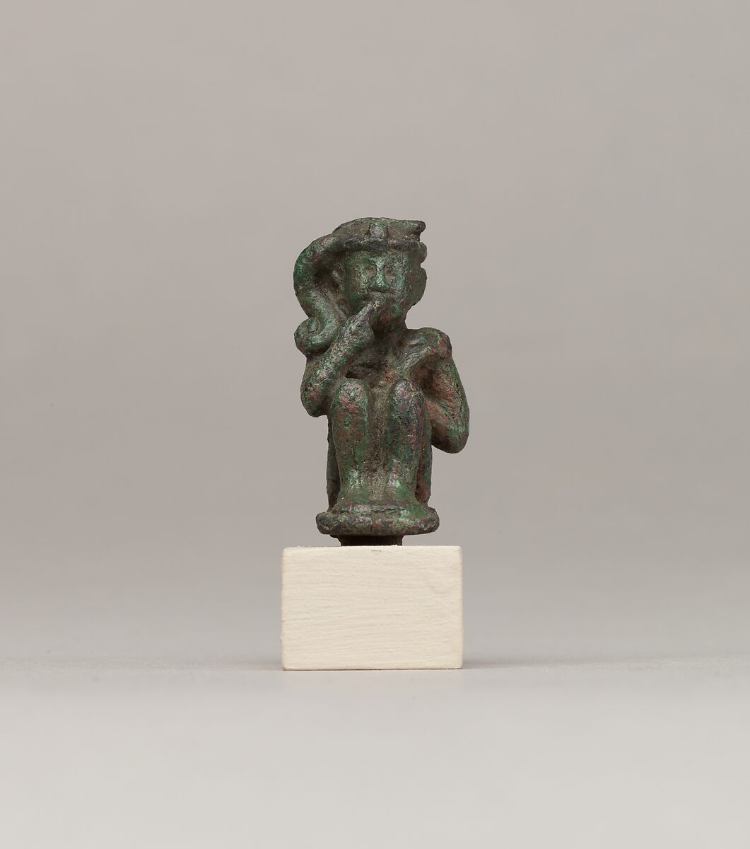 Crouching child god holding scepter, Cupreous metal 