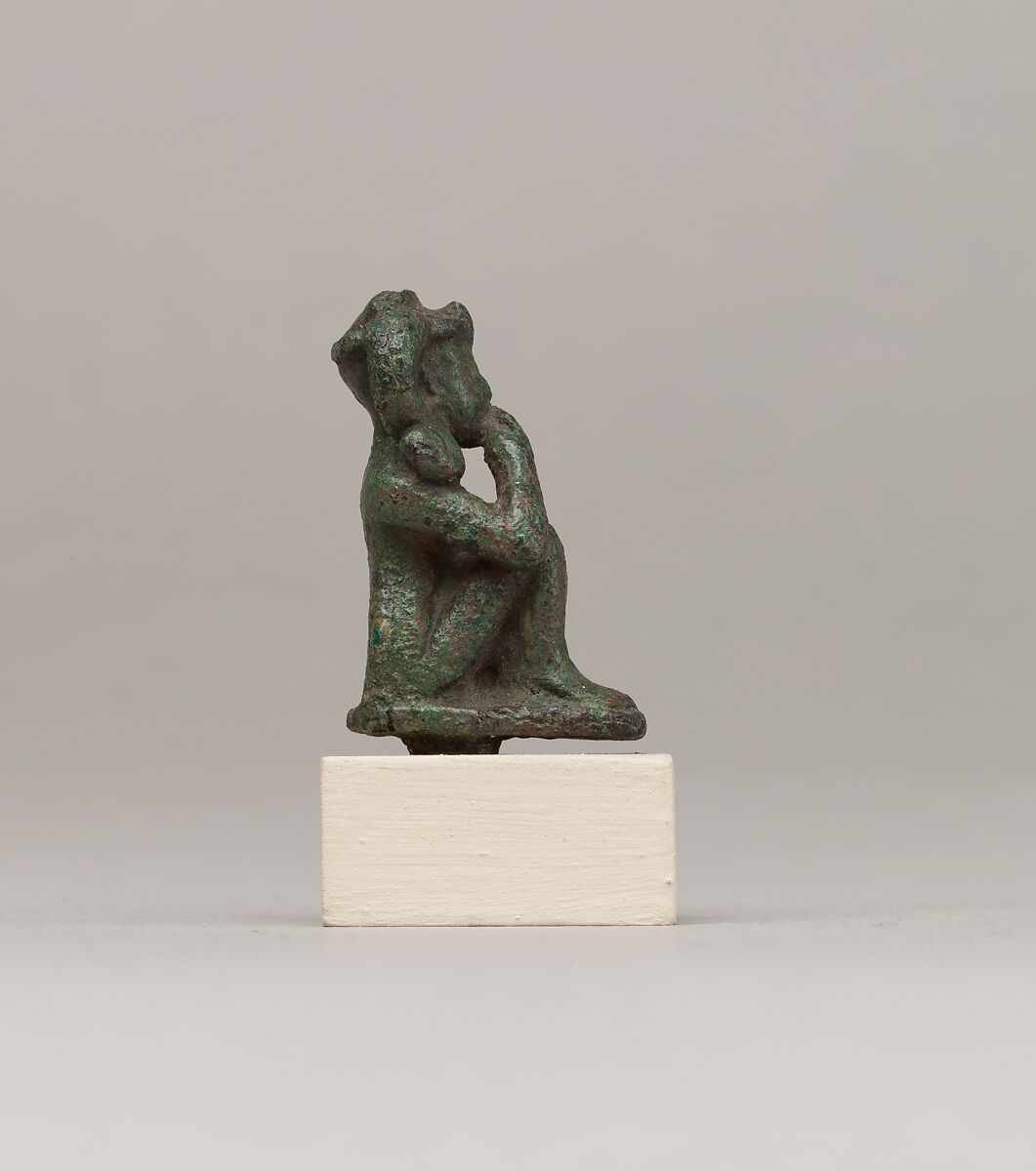 Crouching child god holding scepter, Cupreous metal