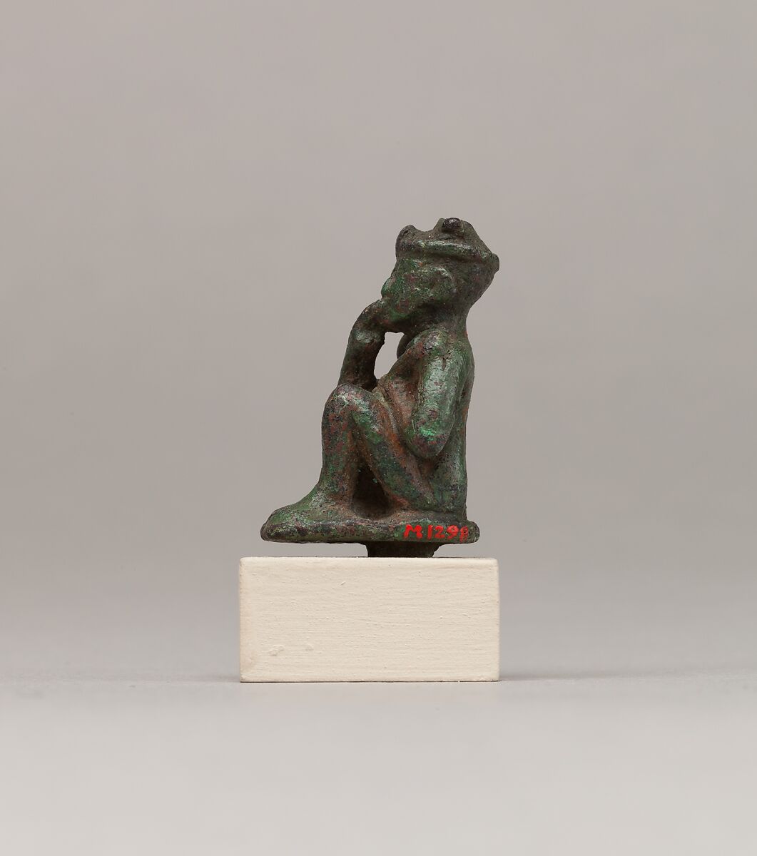 Crouching child god holding scepter, Cupreous metal