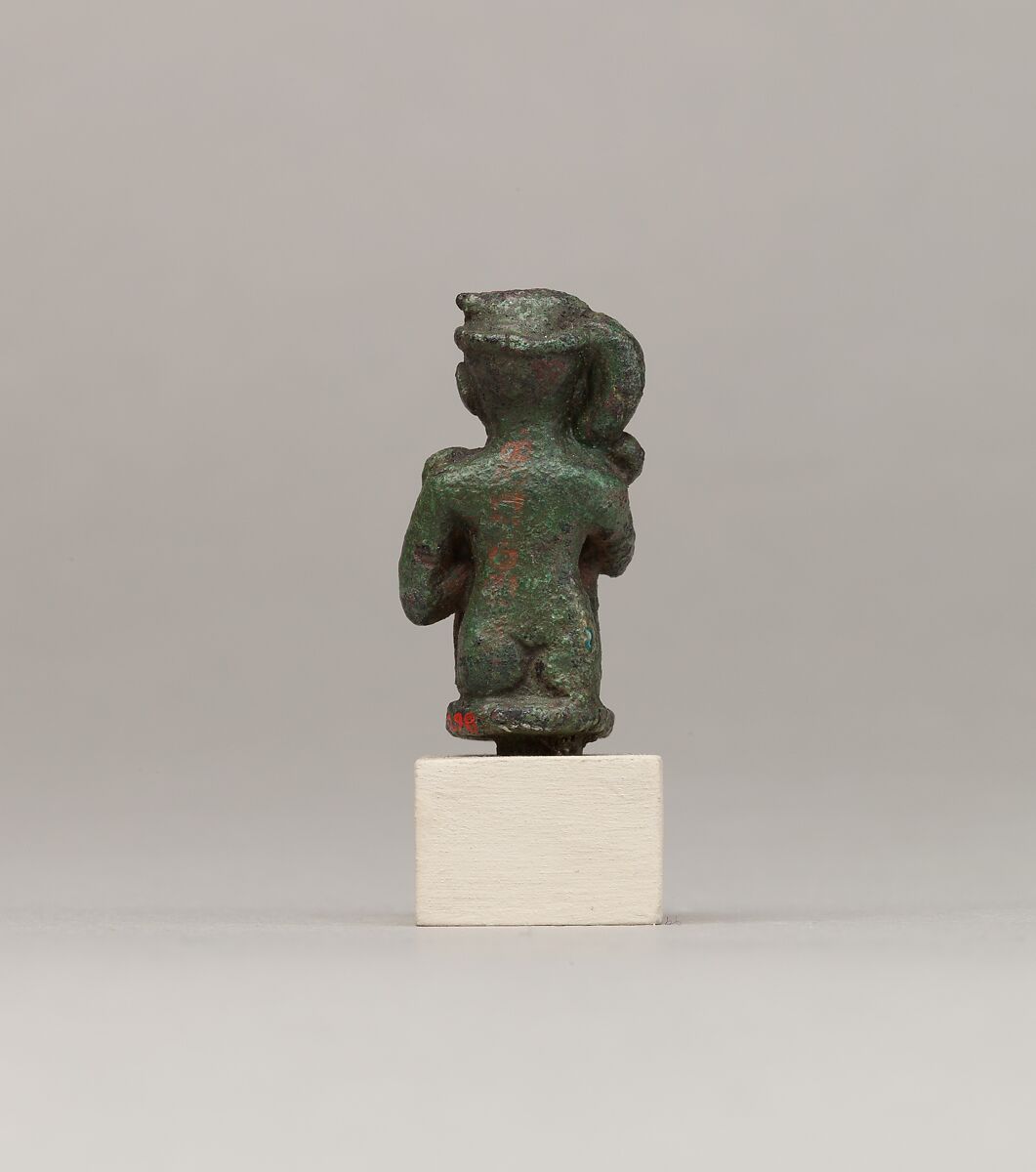 Crouching child god holding scepter, Cupreous metal