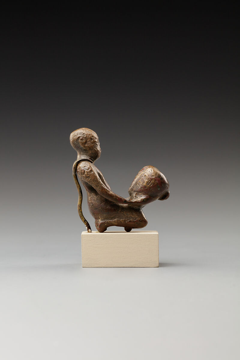 Statuette of a cult attendant with a jar, Bronze or cupreous alloy