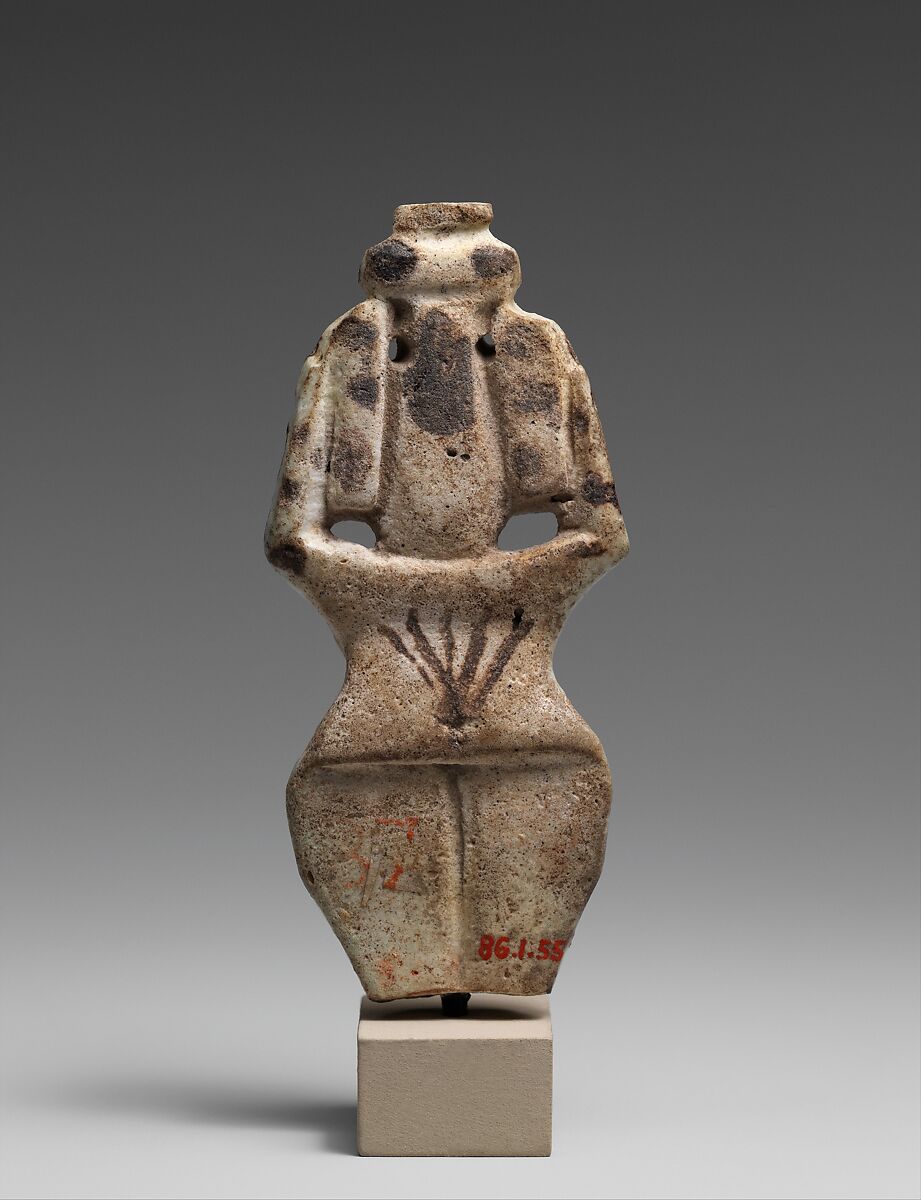 Nude female figure holding a vase on her head, Faience