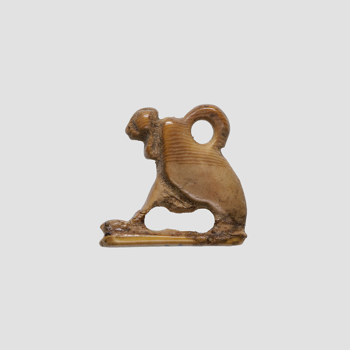 Vulture amulet, Ivory or bone