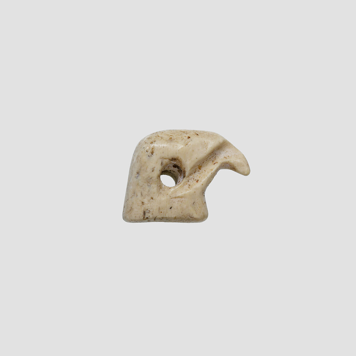 Falcon head amulet, Ivory or bone