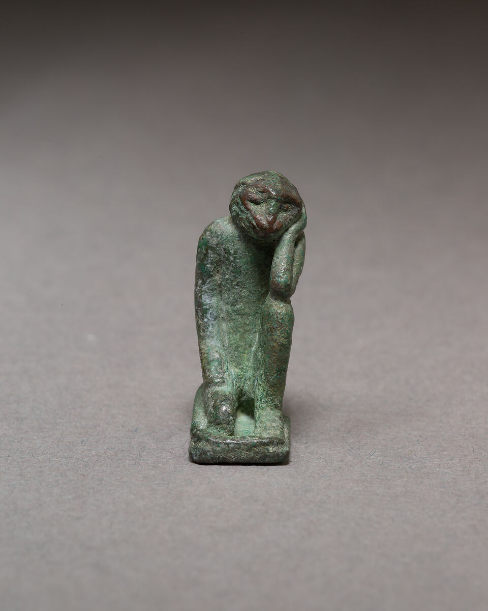 Monkey kneeling and resting its head in a hand, Bronze